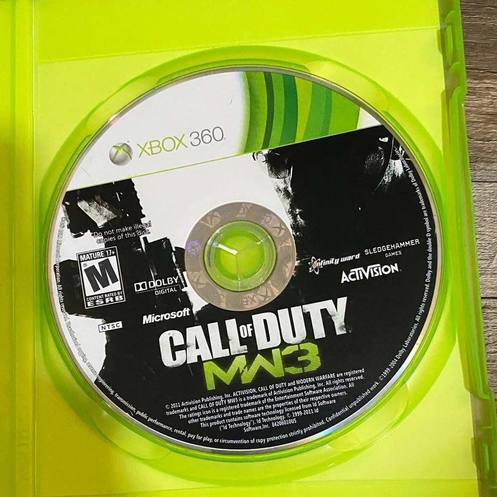 X Box 360 Game Set - Call of Duty MW3 & NCAA Football 12 - Green Cases 3 games